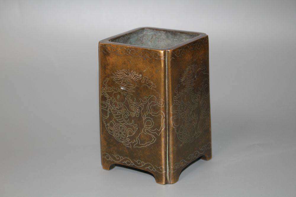 A Chinese bronze and silver inlaid square brush pot,